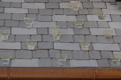 Yellowing Plastic Snow Guards on Synthetic Slate Roof